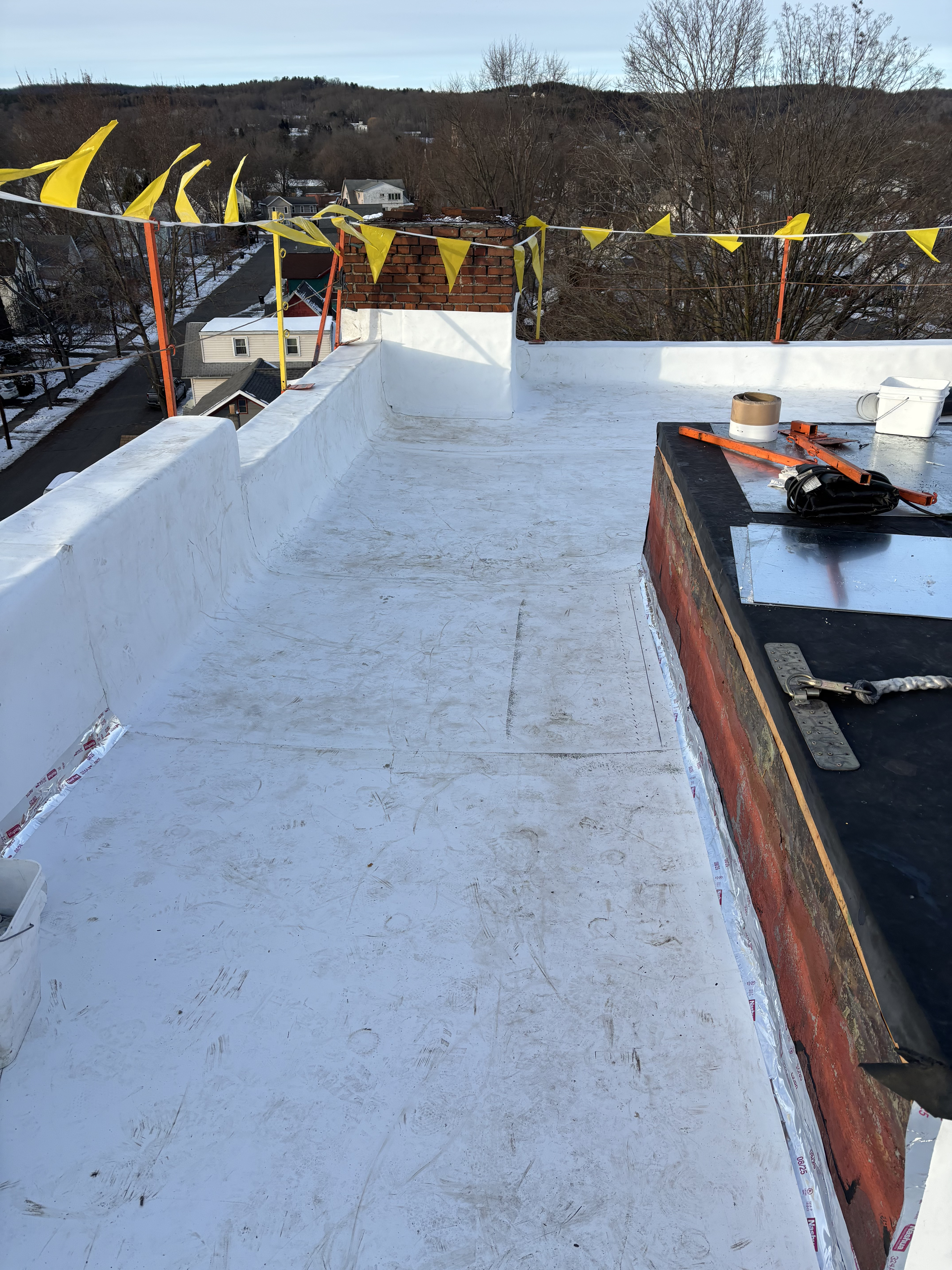 Looking north along Loder St near the northwest corner of the upper roof.